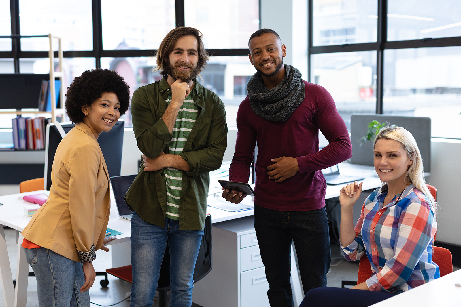 Image of a diverse group of business people posing for the camera, happy that office odor removal services have created a clean environment to work in.